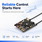 RC receiver circuit board with dual antenna leads, pin headers, and microchip