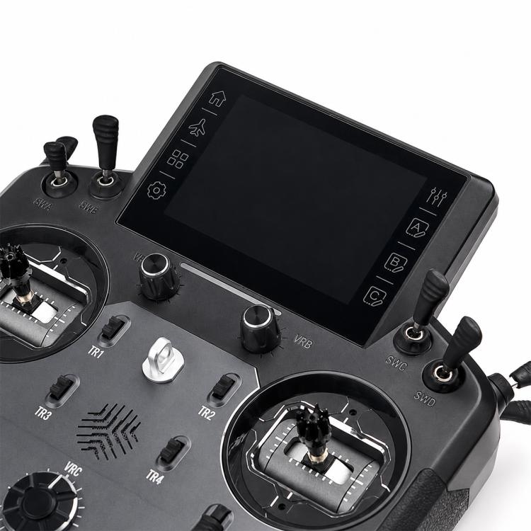 RC radio transmitter top view with touchscreen display, knobs, and switch controls