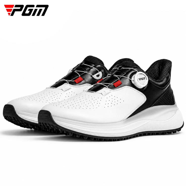 Men’s golf shoe in white and black with red accents, lace-up closure, and textured sole.