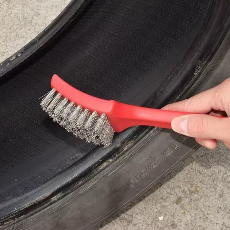 Tire repair wire brush with steel bristles and red handle cleaning tire rubber