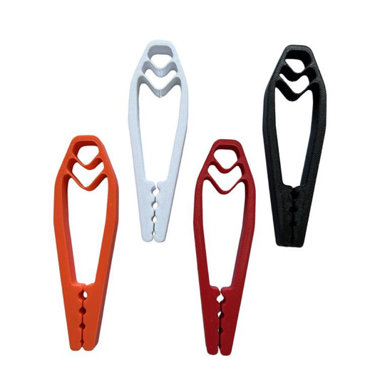 Nail holding clip tool set in orange, white, red, and black, with grip grooves