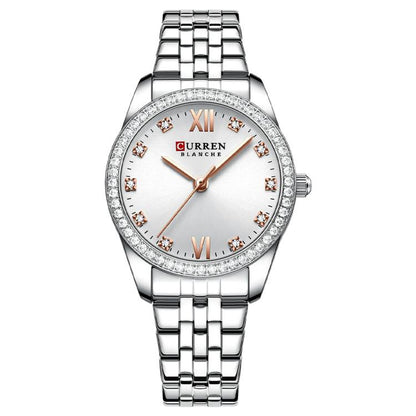 Women’s stainless steel quartz watch with white dial, rhinestone bezel, and metal bracelet