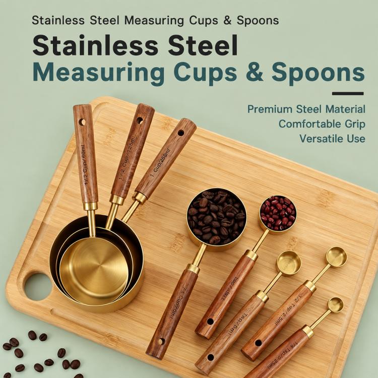 Stainless steel measuring cup and spoon set with wooden handles and gold bowls