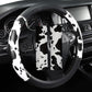 Cow print steering wheel cover with central cutout and black-and-white spotted pattern