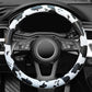 Cow print steering wheel cover covering wheel controls and front rim spokes