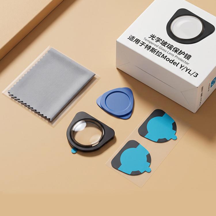 Front camera lens protector kit with black cover, blue film pieces, and cloth pack