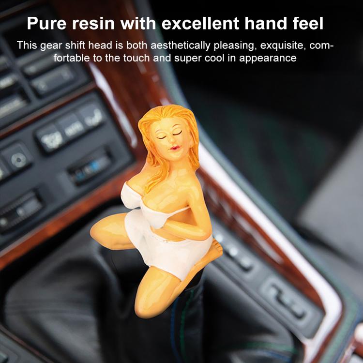 Car manual gear shift knob with glossy white bikini figure topper in center console