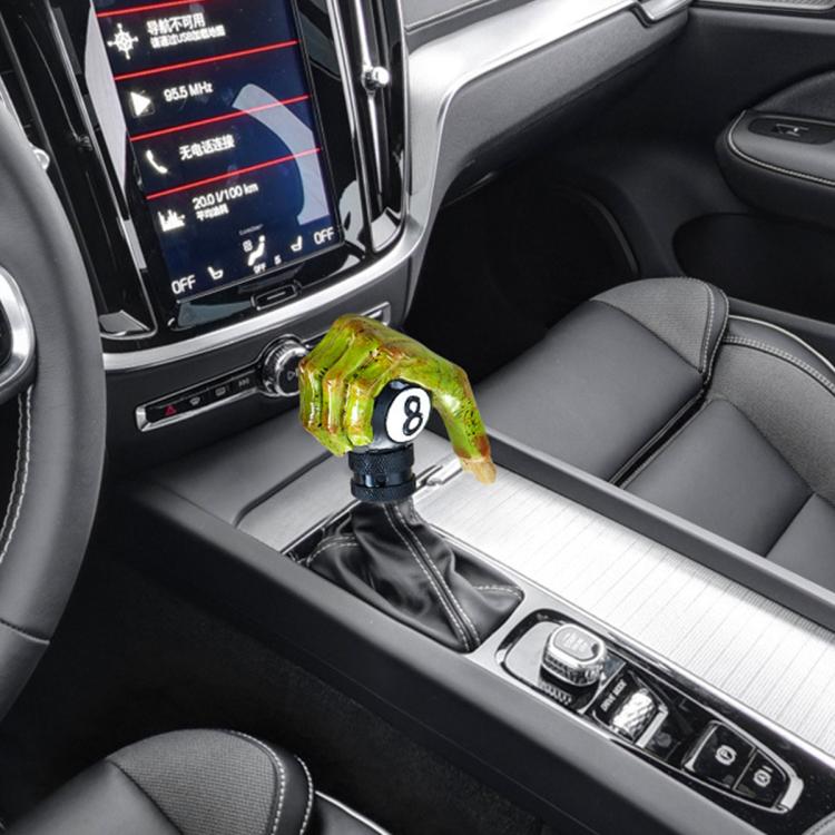 Green resin ram skull gear shift knob with black base, installed in car center console