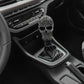 Gray skull-style manual gear shift knob with ornate texture