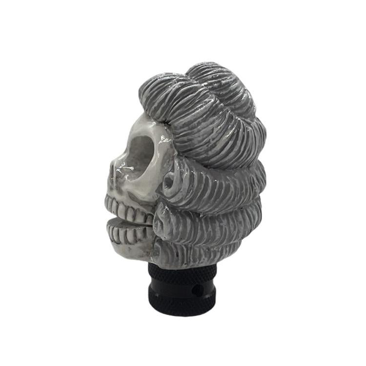 Gray skull-style manual gear shift knob with spiral hair detail