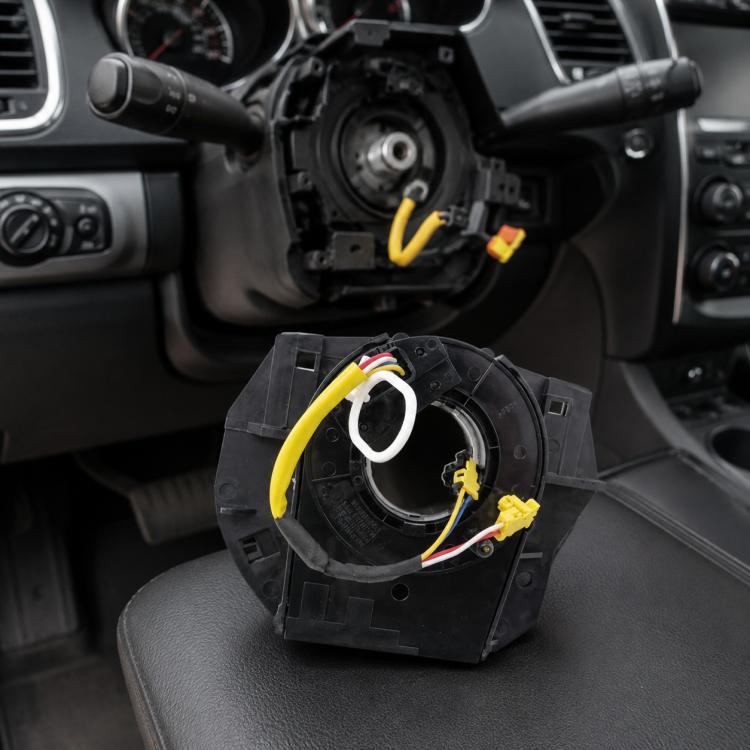 Black steering wheel clock spring spiral cable assembly with yellow and white wiring connectors