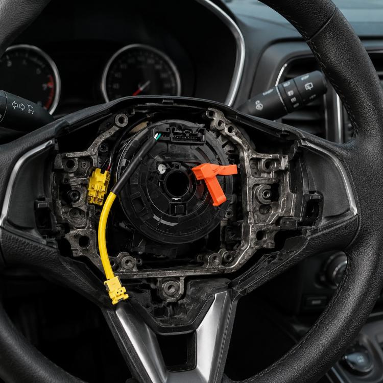 Steering wheel clock spring spiral cable with yellow connectors and orange ribbon tab