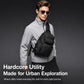 Black crossbody chest bag on a man, showing front zip pocket and side utility straps.