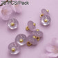 Lavender resin disc buttons with gold loops, glossy finish, small round design