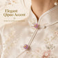Lavender resin disc button with gold loop shank attached to a cream qipao collar tie