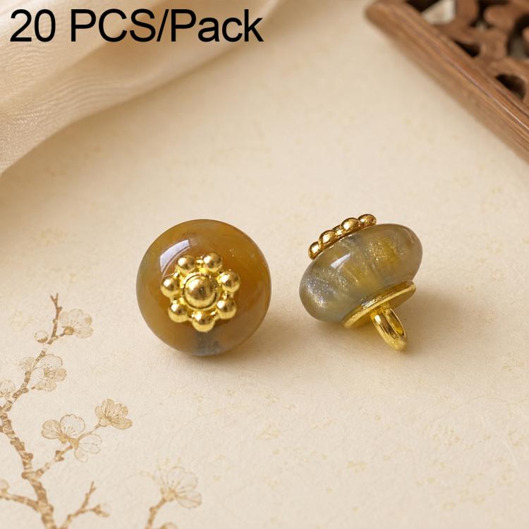 Amber resin flat flower-shank buttons with gold decorative flower tops, 2 shown