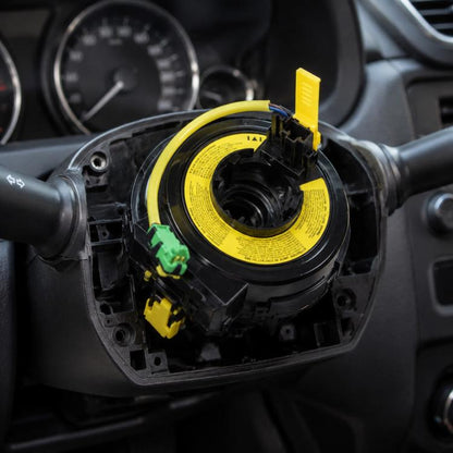 Airbag clock spring spiral cable with yellow circuit housing and connector plugs