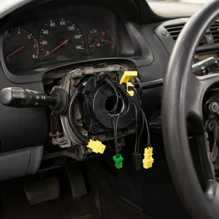 Steering wheel airbag clock spring assembly with spiral cable and yellow and green connectors