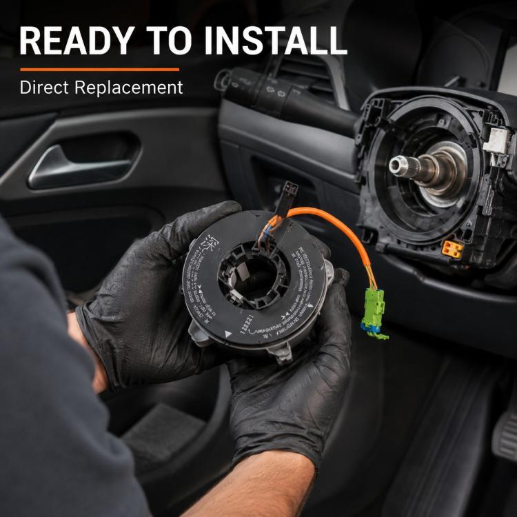 Car steering wheel airbag clock spring held in gloved hands with orange cable and plugs