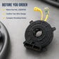 Clock spring spiral cable on work surface, black housing with yellow wires