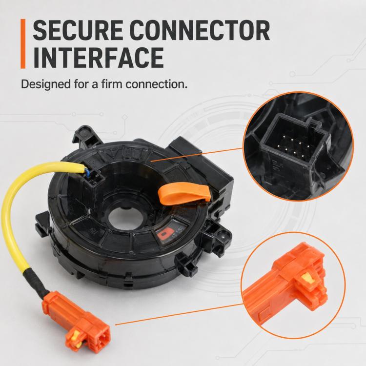 Clock spring spiral cable with orange connector tips and yellow wire, close-up