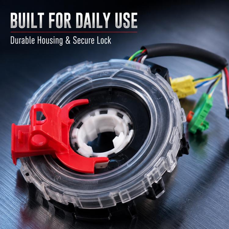 Steering wheel clock spring spiral cable close-up with red lock and multicolor wire ends