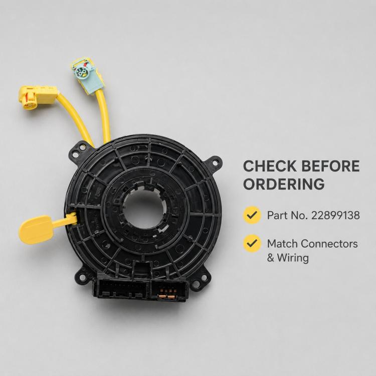 Steering wheel clock spring spiral cable, front view with yellow and teal wire connectors