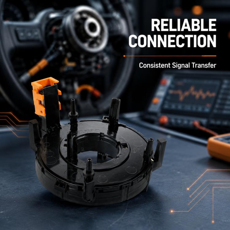 Steering wheel clock spring spiral cable module on bench, black housing with orange connector