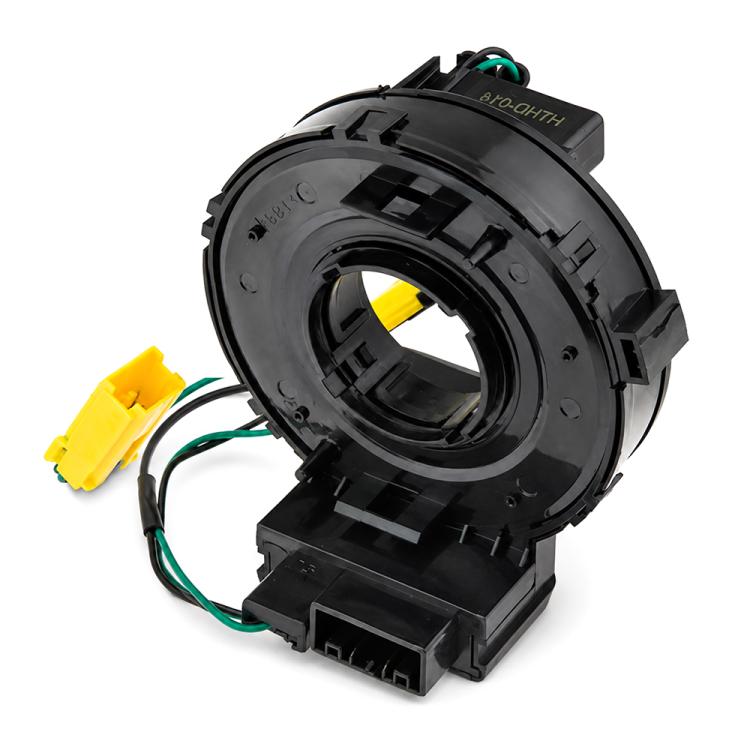 Steering wheel clock spring spiral cable close-up of black housing ring and yellow wires