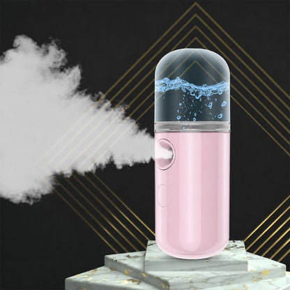 Pink portable facial nano mist sprayer with visible cold mist plume