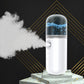 White portable facial nano mist sprayer with visible cold mist plume