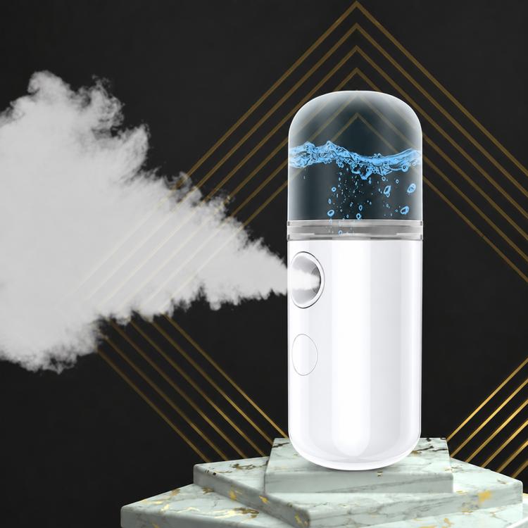 White portable facial nano mist sprayer with visible cold mist plume