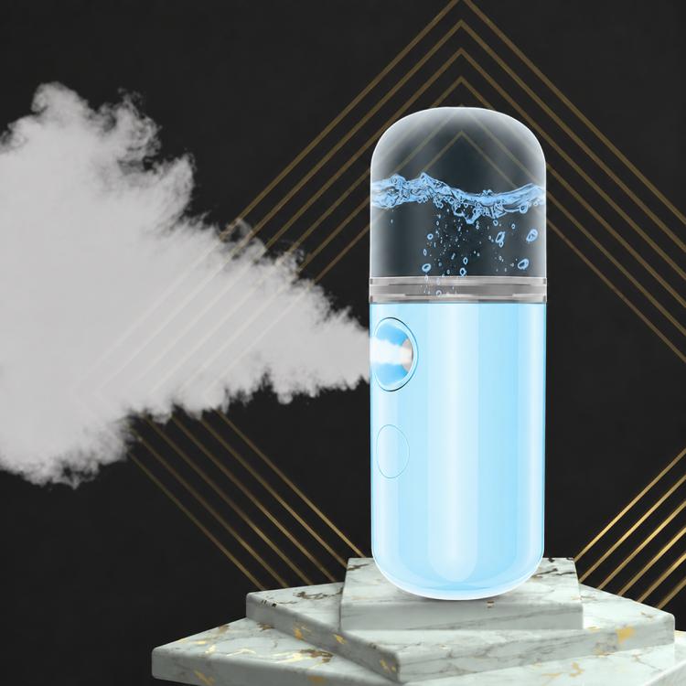 Blue portable facial nano mist sprayer with visible cold mist plume