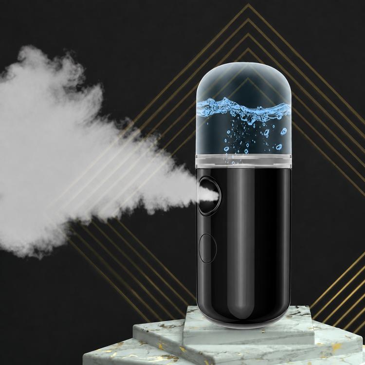 Black portable facial nano mist sprayer with visible cold mist plume