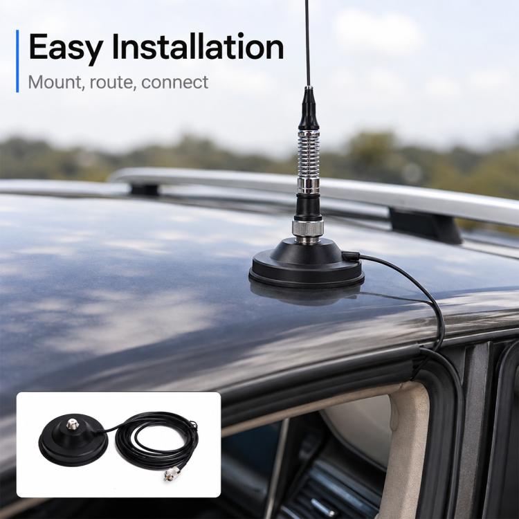 Magnetic antenna base mounted on vehicle roof with coax cable and antenna mast