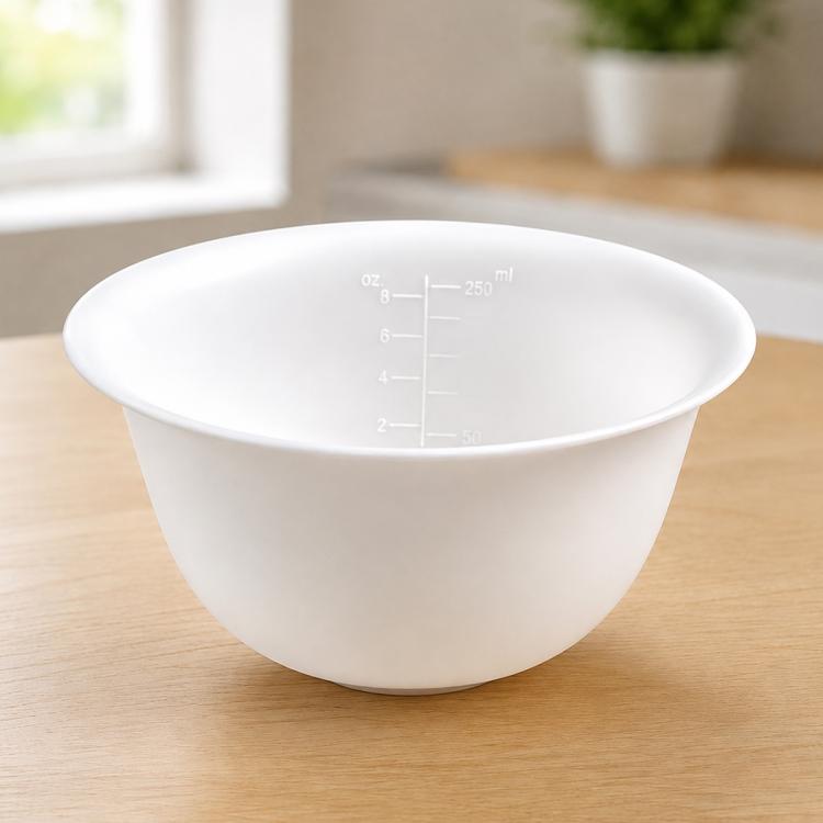 White soft silicone mixing bowl with clear oz and ml measurement markings