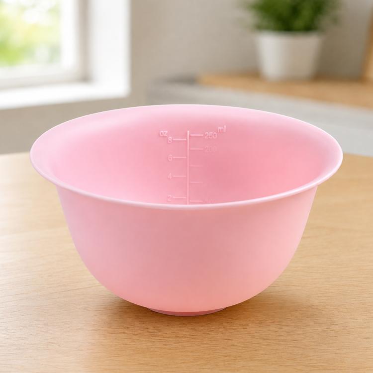 Pink soft silicone mixing bowl with clear oz and ml measurement markings