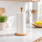 Bamboo tissue roll holder with ball-topped post and white roll on round wooden base