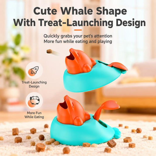 Two whale-shaped treat-launch toys on floor, teal base with orange whale
