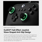 Close-up of black gaming controller with green glowing ring accents on buttons