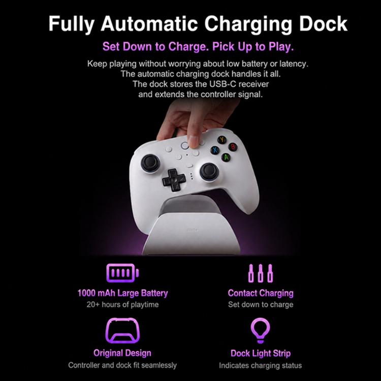 White gamepad resting on charging dock with finger pointing above it