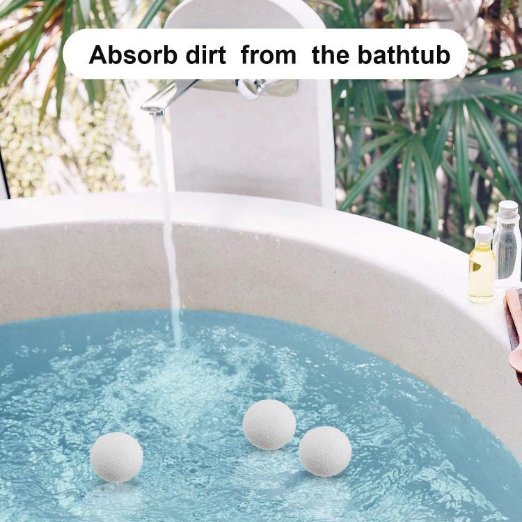 Reusable sponge balls floating in a bathtub to absorb dirt