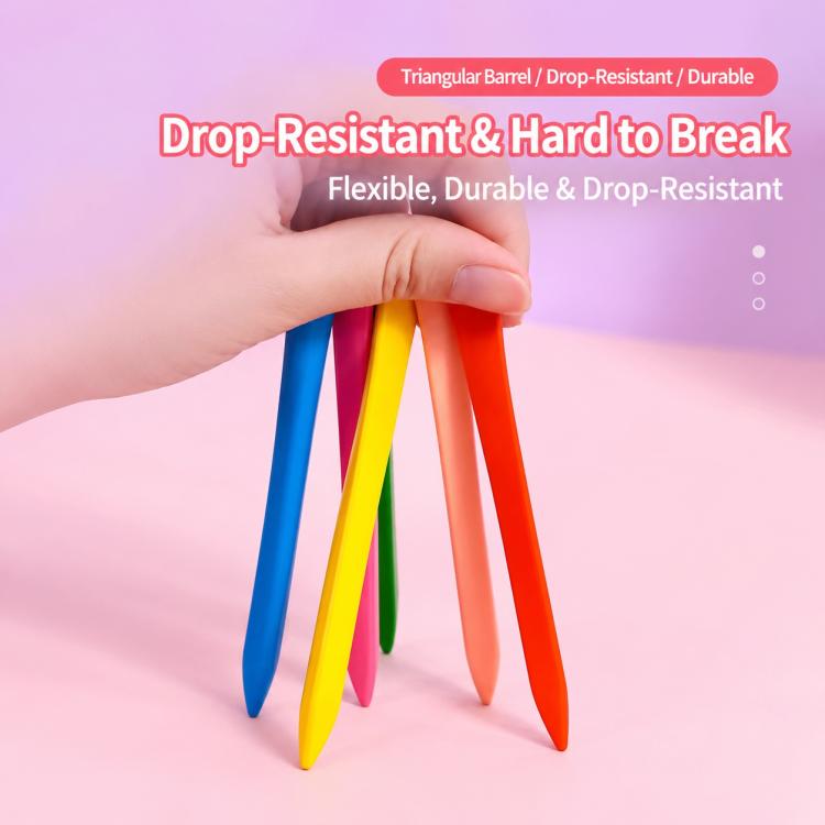 Hand holding triangular plastic crayons, assorted blue yellow green orange tips