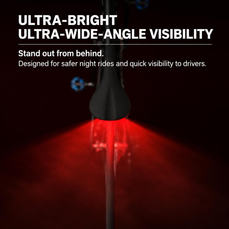 Bike tail light emitting a wide red beam from the rear