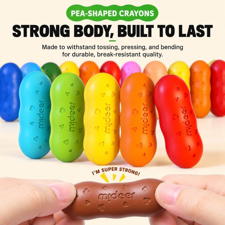 Pea-shaped crayons in rainbow colors with hand holding a brown crayon