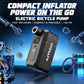 Compact electric bicycle inflator pump with black and gray body.