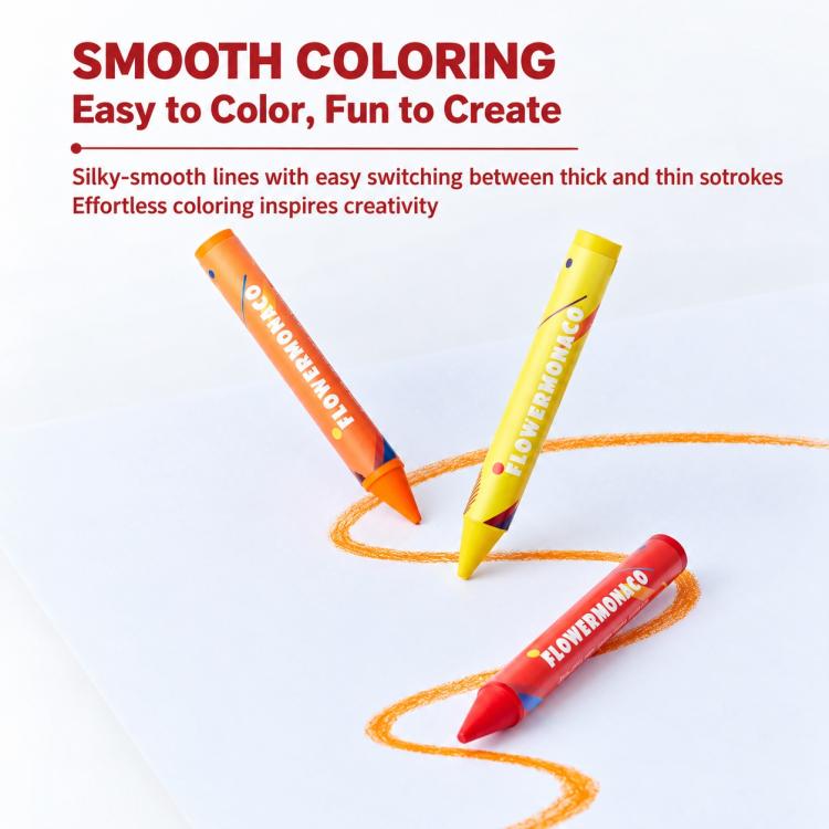 Children’s palm crayons coloring on paper, three bright crayons leaving smooth lines