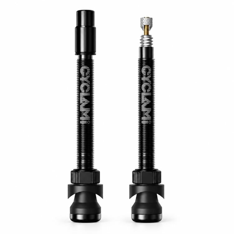 Pair of black Presta tubeless valve extenders with long aluminum stems and rubber bases