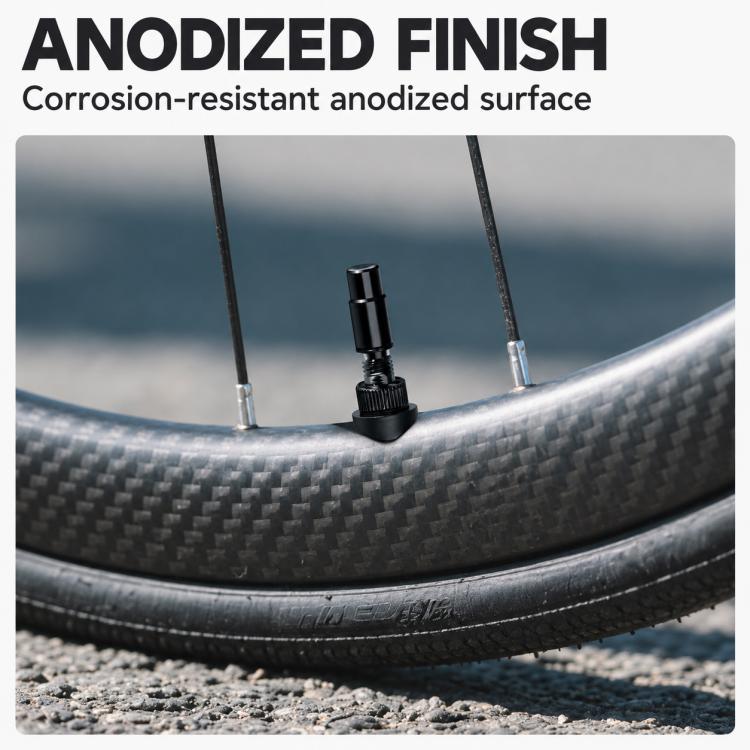 Black tubeless Presta valve extender with rubber base and aluminum stem