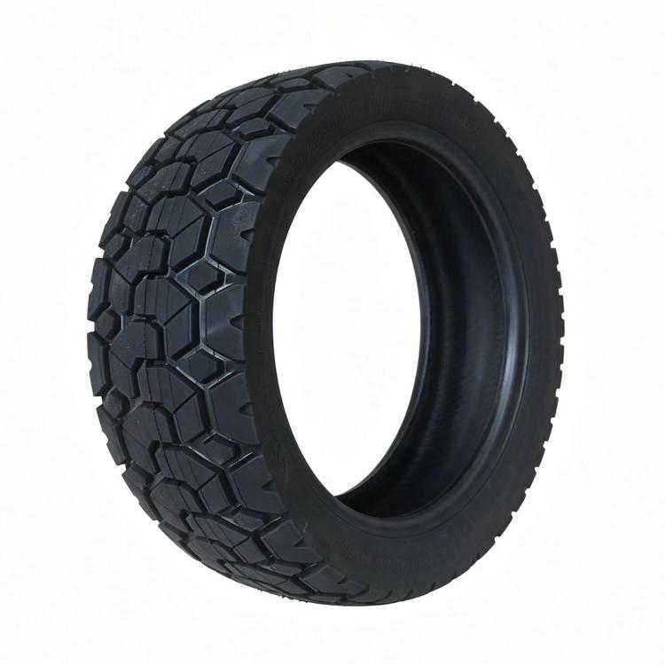 Black 11-inch tubeless scooter tire with deep tread pattern, single tire